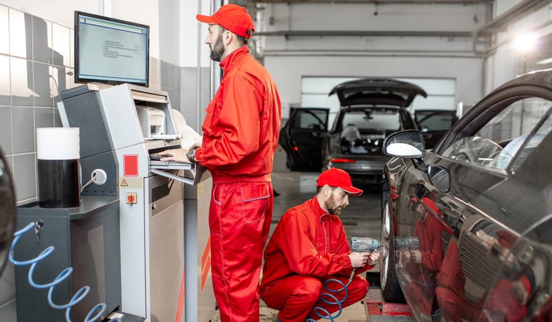 Mechanics servicing vehicles